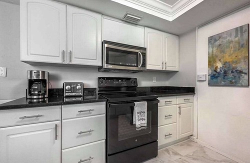East Naples House | Dog-friendly lakefront home with hot tub, gazebo, firepit, outdoor kitchen, W/D