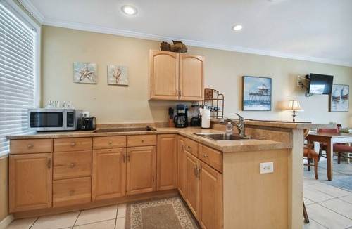 Bay Esplanade Apartment | Enchanted Inn Suite #5: Waterfront, Pool, Fishing Dock, Boat Docks & Tiki Bar!