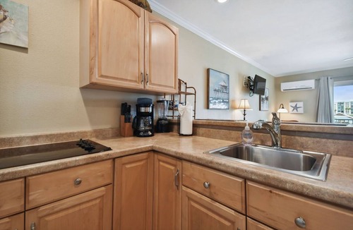Bay Esplanade Apartment | Enchanted Inn Suite #5: Waterfront, Pool, Fishing Dock, Boat Docks & Tiki Bar!