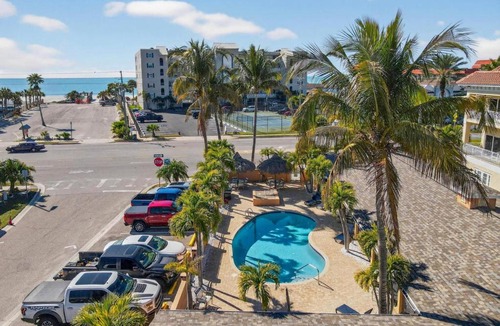 Redington Shores Apartment | Enjoy Sunny Days by the Pool and Beautiful Sunset Beach Walks at Coconut Villa's Suite 10!