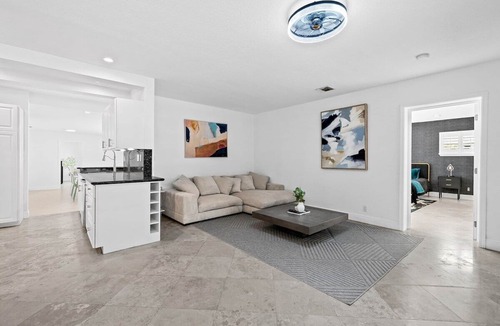 Dolphin Isles House | Entire Lux Home ~ Heated Pool ~ 5 min walk to beach ~ Game Room ~ Bikes
