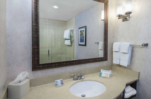 Far North Central Hotel | Escape to Comfort in a Quiet Room Near The Rim Shopping Center - 0.7 miles