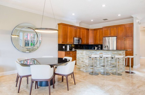 Coral Ridge House | Exquisite home with jetted bathtub, balconies, enclosed yard & elevator
