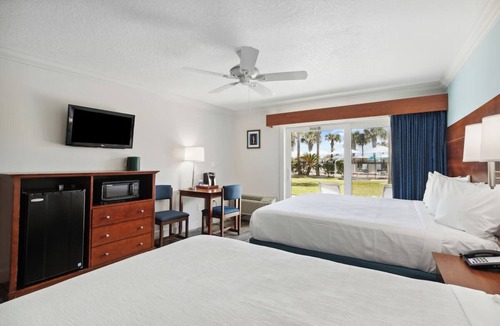 Neptune Beach Hotel | Family Seaside Haven: 3 Comfortable Rooms | Outdoor Pool | Pet-Friendly