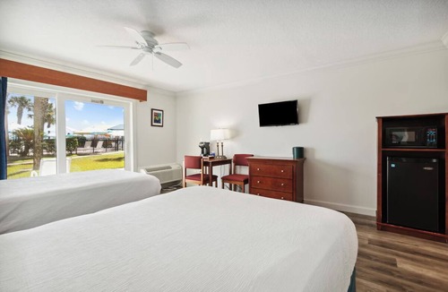 Neptune Beach Hotel | Family Seaside Haven: 3 Comfortable Rooms | Outdoor Pool | Pet-Friendly
