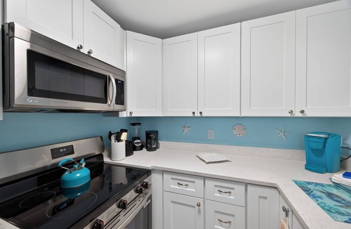 Indian Shores Condo | FIRST FLOOR! DIRECT"WATERFRONT" Newly Renovated! Walk to Beach! King Bed
