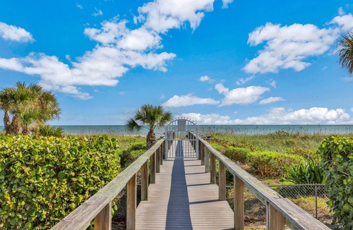 Cape Caneveral Beach Gardens Condo | Ground floor condo w/shared pool, fast WiFi, central AC, near beach access