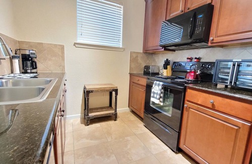 Davenport Condo | Ground floor condo, no carpet, community pools, fitness room, 9 miles to Disney World