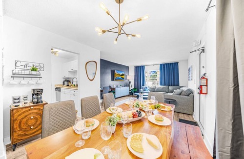 Survey Creek Apartment | Ground Floor - Water View - Palm Wave Says