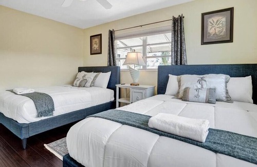 Garden Isles Villa | Heated Jacuzzi &Pool~Waterfront Villa By Beach