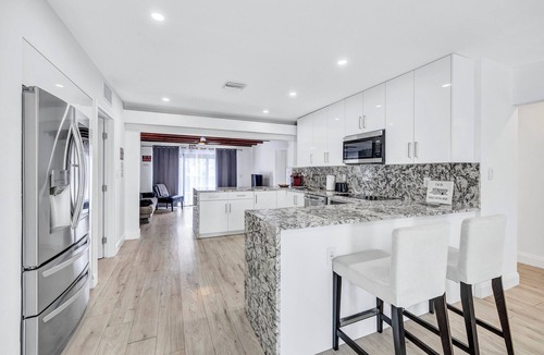 North Central Hollywood House | HEATED Pool Home on Lake Hard Rock Guitar Hotel Beach Airport