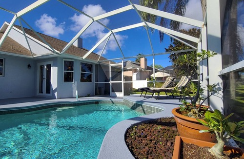 West Melbourne House | Heated pool, lakeview, double king size, 4 bedrooms, 6 beds, 2 bath, sleep 12