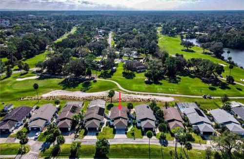 Palm Harbor House | KoKo Hut Golf Views Fenced Coastal Cottage