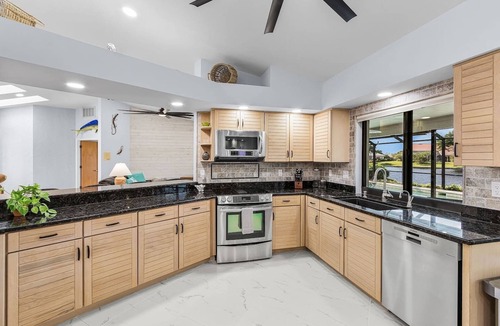 Town and River Villa | Lakefront Paradise – Heated Pool & Near Beaches