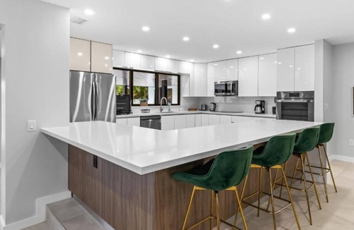 North Miami Beach Villa | Lakefront Tropical Villa by Glam Homes