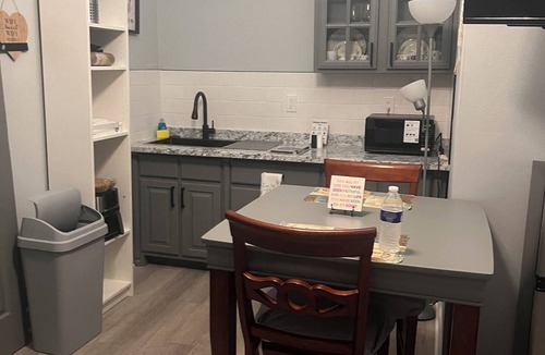 Tampa Heights House | Location Location Mini Jr. Suite. 1-bedroom queen bed behind barn doors.