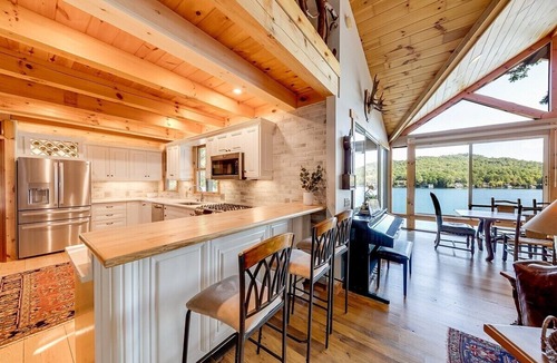 Clarkesville House | Luxury 5BR Lake Burton home with dock, game room, and lakeside views.