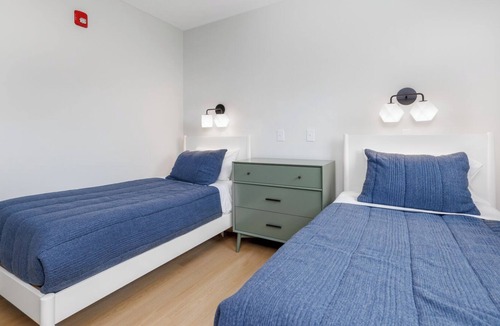 Village Green Apartment | Luxury Flat with sweeping marina views! Access to two pools and paddle club!