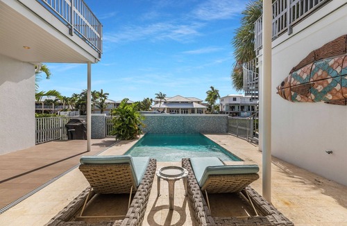 Coury House | Luxury Key Colony Beach Home | Coral Pool, Rooftop Deck + Ocean Access Dock
