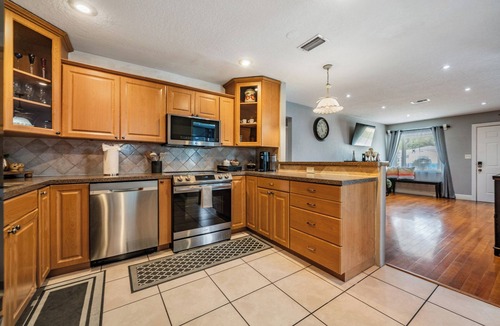St. Petersburg - Clearwater House | NEW 4BR Spacious Retreat | Fire Pit + Game Room