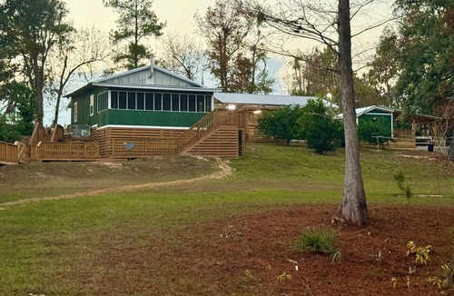 Bristol Cottage | New listing! Waterfront with dock, boat ramp! Surrounded by tupelo & cypress!