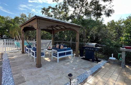 Port Pine Heights House | NEWLY RENOVATED 3/2 WITH POOL AND CANAL ACCESS! Pet-Friendly