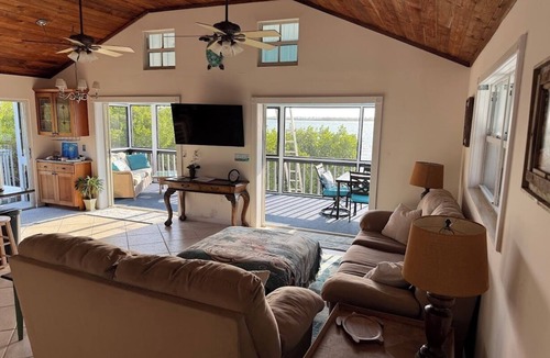 Breezeswept Beach Estates House | Oceanfront 2 bedroom, Pet friendly on Ramrod Key with screened porch and kayaks