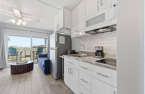 Crescent Beach Condo | Oceanfront Patio Suite with daily housekeeping and welcoming front desk staff