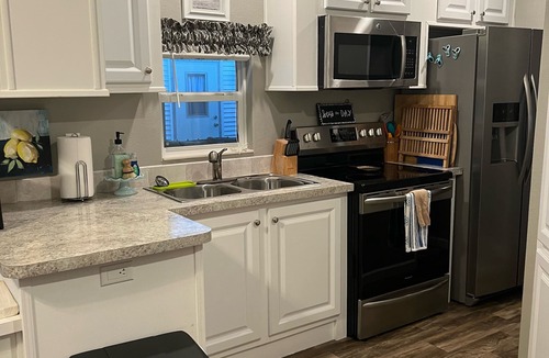 Miramar Beach Cottage | One block from the beach at Pompano Joes with large patio golf carts allowed