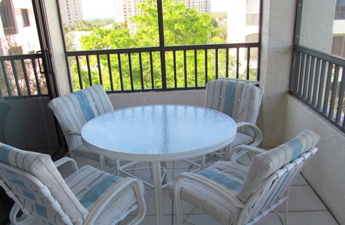 Pelican Bay Condo | OUTSTANDING LOCATION. End Unit Top Floor Condo near Beach, favored Pelican Bay