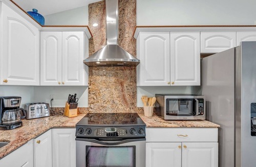 Coury House | P27 - Private Beach Access! Pool home with everything you need for an unforgettable vacation. 3 bedroom 2 baths with deep water dockage.