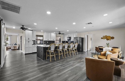 Lake Clarke Shores House | Palm Blanc- Modern Retreat Pool Firepit