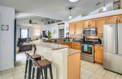 Palm Coast Cottage | Palm Coast Comfort: Family Home w/Lanai, Big Yard