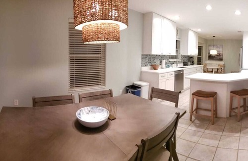 Butler Beach House | Paradise by the River - Relax in Style Near the Beach! Pool and Heated Spa