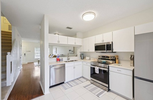 Sabal Harbour House | Peaceful Lakeside Stay with Private Screened Patio-Community Pool-Near Beaches