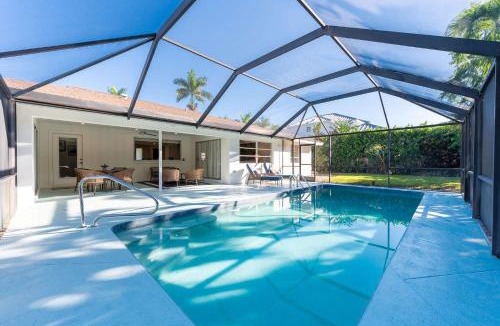 Moorings House | Pesaro - stylish 3BR retreat near Via Miramar Beach, beautifully renovated home with a private pool, lush tropical gardens and premium modern comforts, perfect for families and relaxing getaways, just minutes from sandy beaches and vibrant downtown Naples