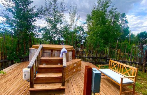 San Cristobal House | Petite Log Cabin on Organic Farm in New Mexico