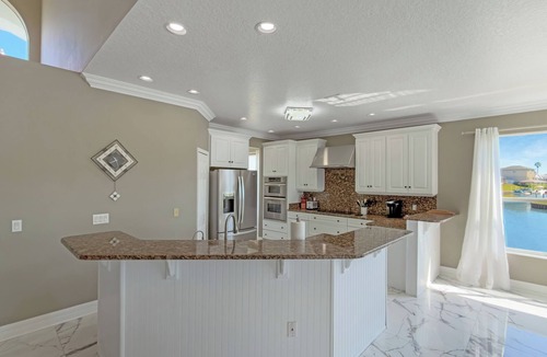 Palm Harbor House | Pool and canal front home in Palm Coast!