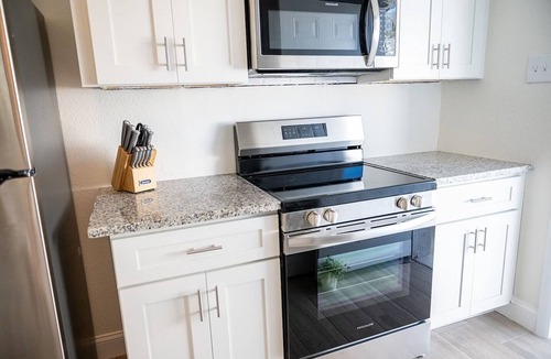 Indian Rocks Beach House | Rare last-minute DISCOUNT in Indian Rocks Beach! Renovated 3BR WATERFRONT single family home with private dock sleeps 8, WALK to the sugar-white sand beach, Includes paddle board, beach chairs, wagon & umbrellas. 3bdrm, 2 bthrm, sleeps up to 8.