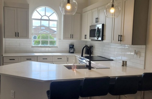 Lake Wales House | Relax in this remodeled home with screened 36-ft pool, patio & fire pit.