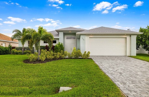 Mariner House | Relax & Unwind: Canal-Front Escape with Pool, Hot Tub & Lanai