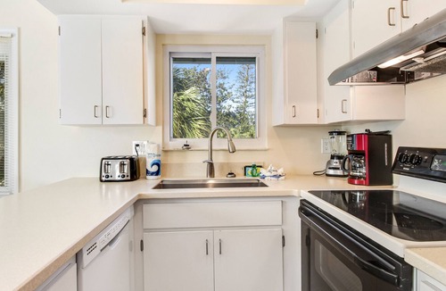 Holmes Beach House | Remodeled duplex with heated private pool - close to beach, dogs welcome