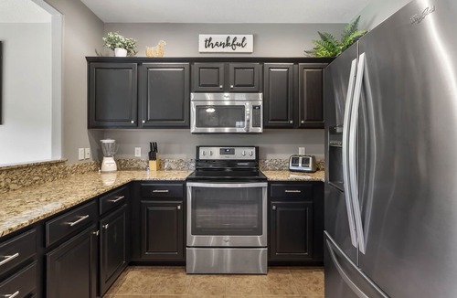 Branson West Condo | Renovated Cabin with Screened-In Porch, Life-Size Games, Community Pools & Free Tickets Near SDC