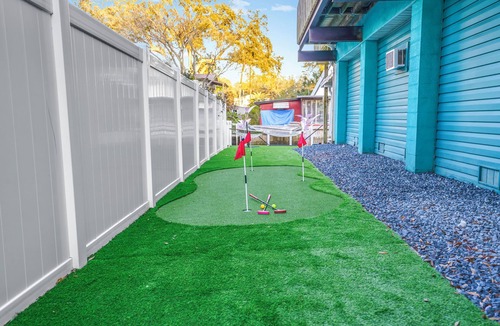 Weeki Wachee Gardens House | River home with huge arcade, hot tub, kayaks, mini golf course, 80in TV