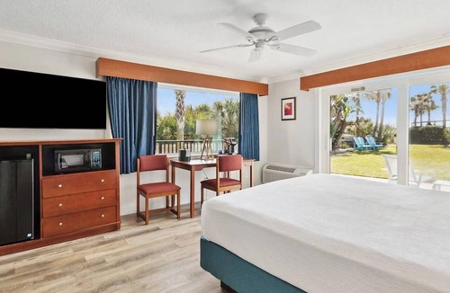 Neptune Beach Hotel | Salty Beachside Haven with Outdoor Swimming Pool and Stunning Ocean Views