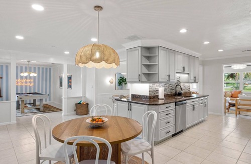 Palma Sola House | Serene Lakefront Retreat | Private Dock and Pool!