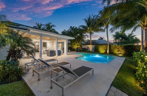 Singer Island Villa | Seven Palms Waterfront- Private Dock, Heated Pool & Lanai -Walk to beach! by Maven Vacation Rentals