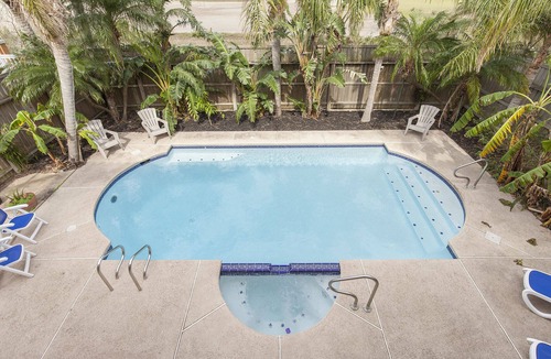 South Padre Island House | Spacious Bayside Retreat with Large Heated Pool & Hot Tub!