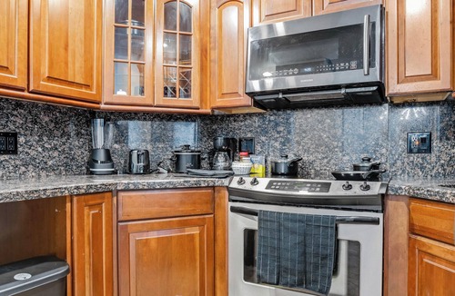 Bermuda Riviera Condo | Spacious Beach Retreat - Private Beach - Pool & Tiki - Ping Pong & Hockey Table