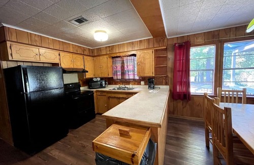 Zwolle Cabin | Spacious Waterfront Cabin with Stocked Pond Views & Resort Amenities near Zwolle, Louisiana
